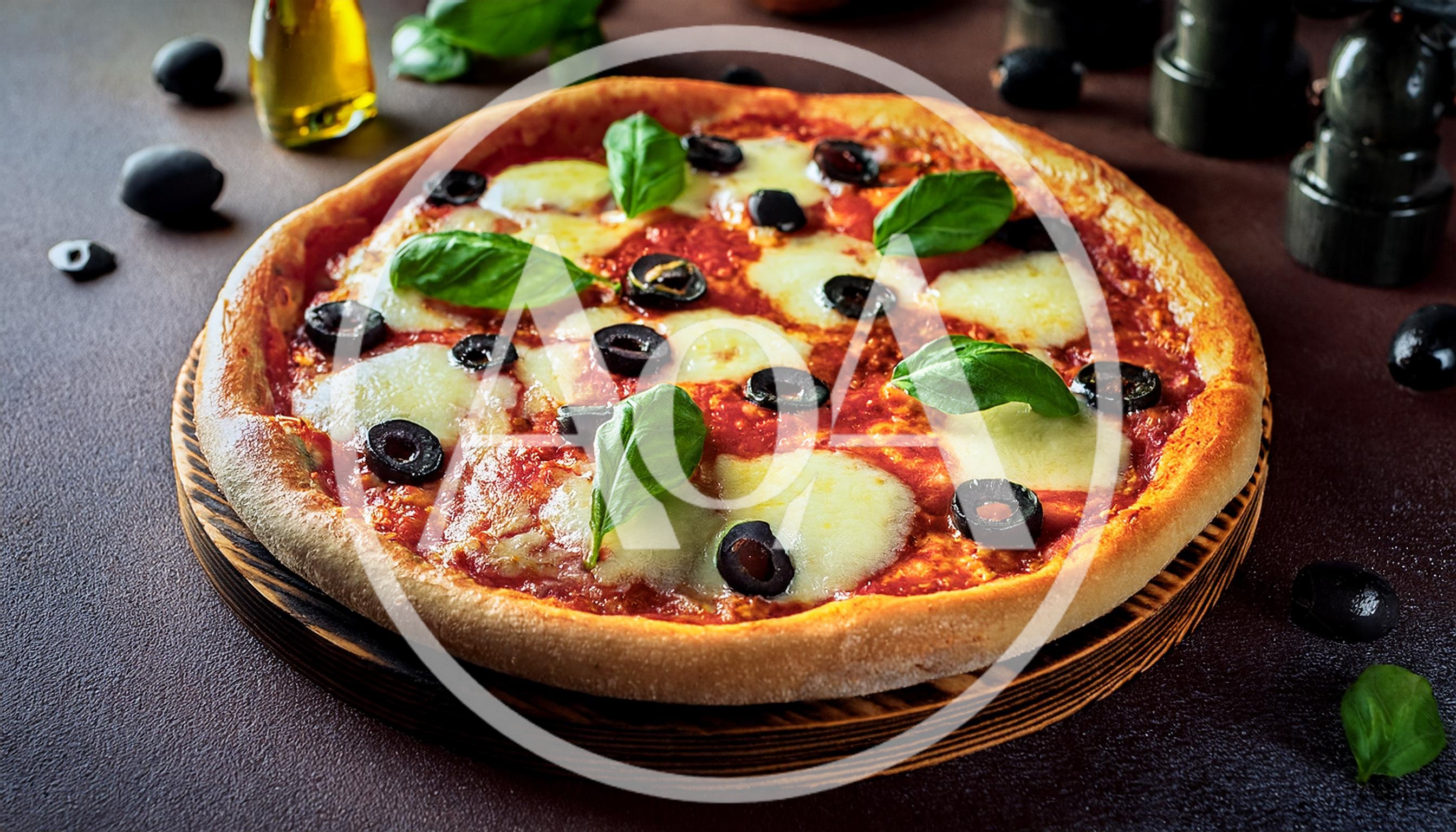 Freshly Baked Pizza With Olives And Basil