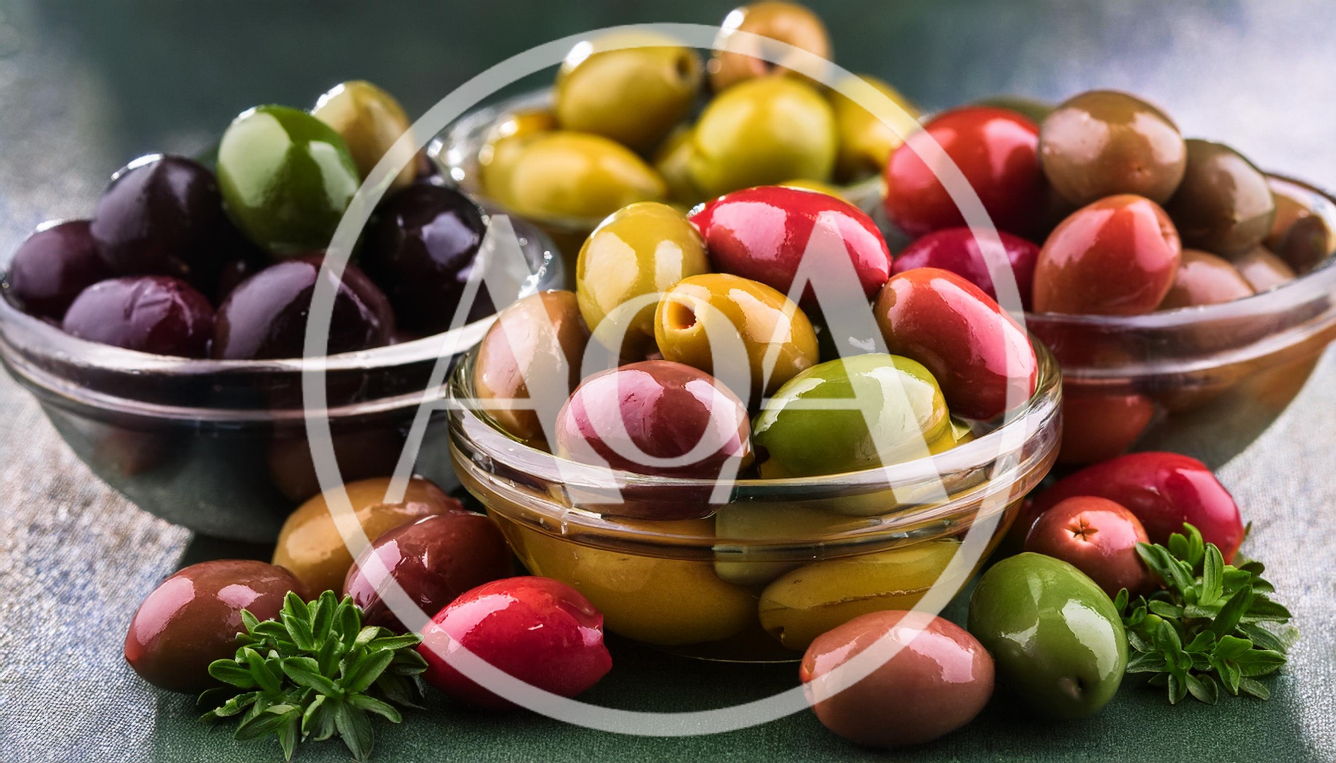 Assorted Colorful Olives in Glass Bowls