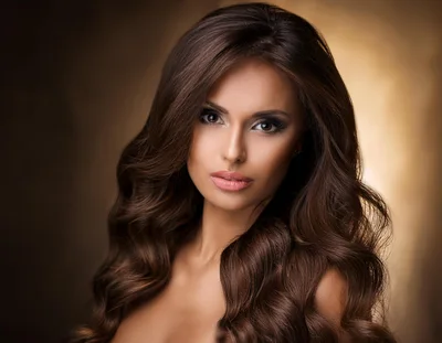 Portrait Of A Beautiful Woman With Long Wavy Hair