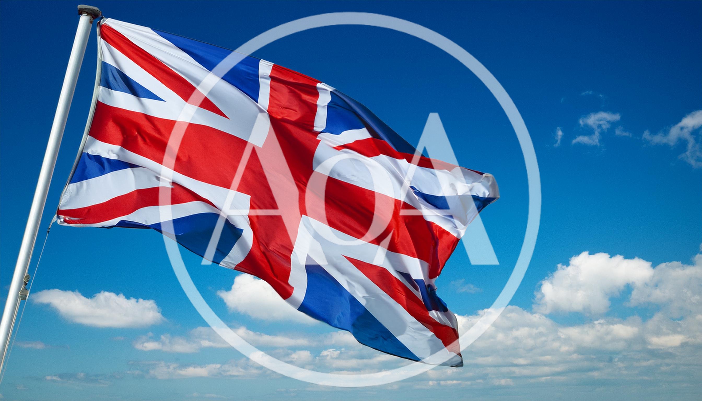 United Kingdom Flag Waving Against Blue Sky