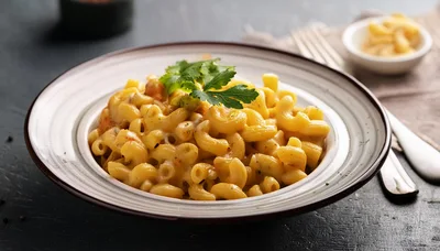 Bowl Of Creamy Macaroni And Cheese With Parsley