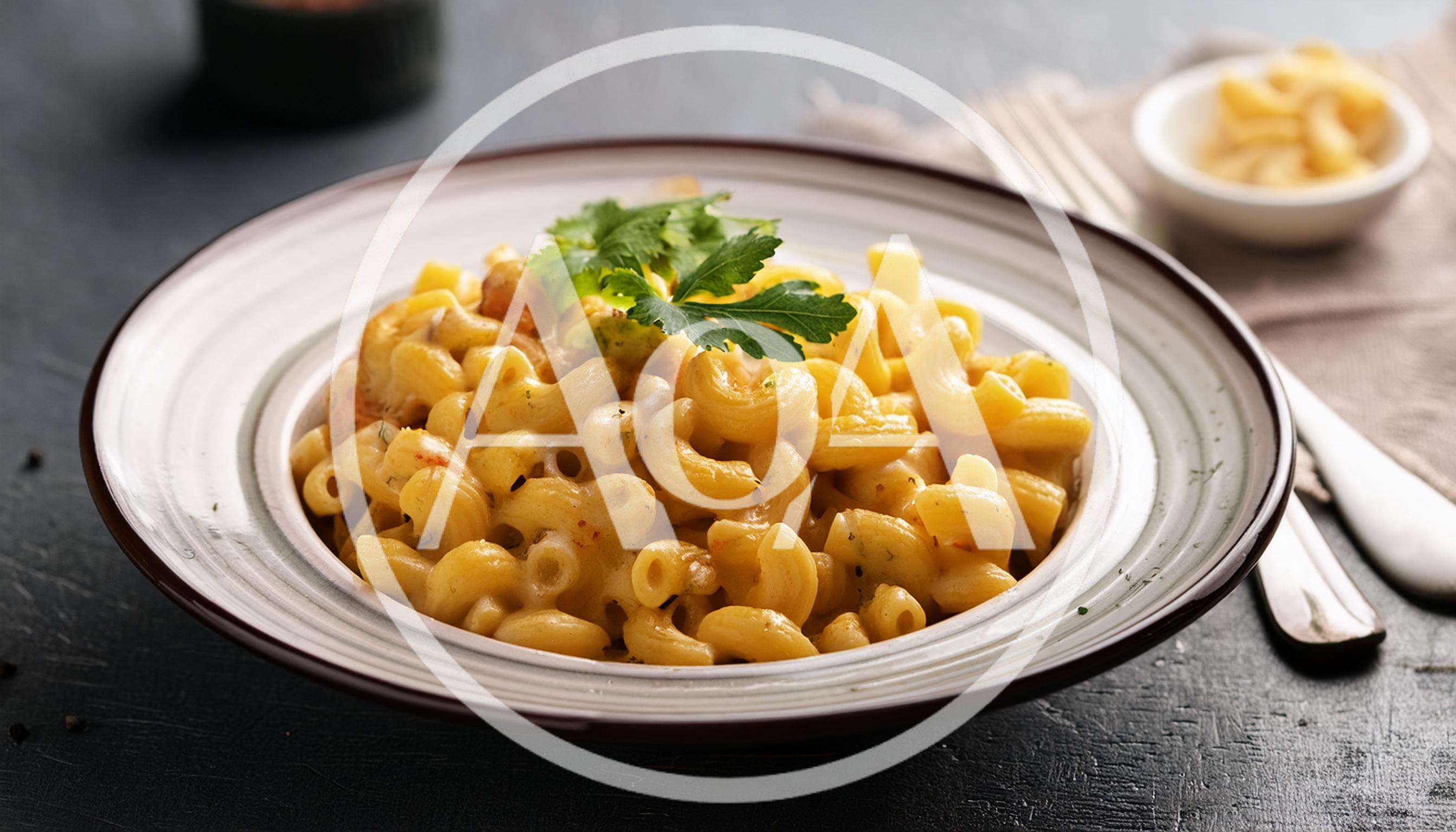 Bowl Of Creamy Macaroni And Cheese With Parsley