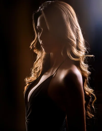 Portrait Of A Woman With Long Wavy Hair