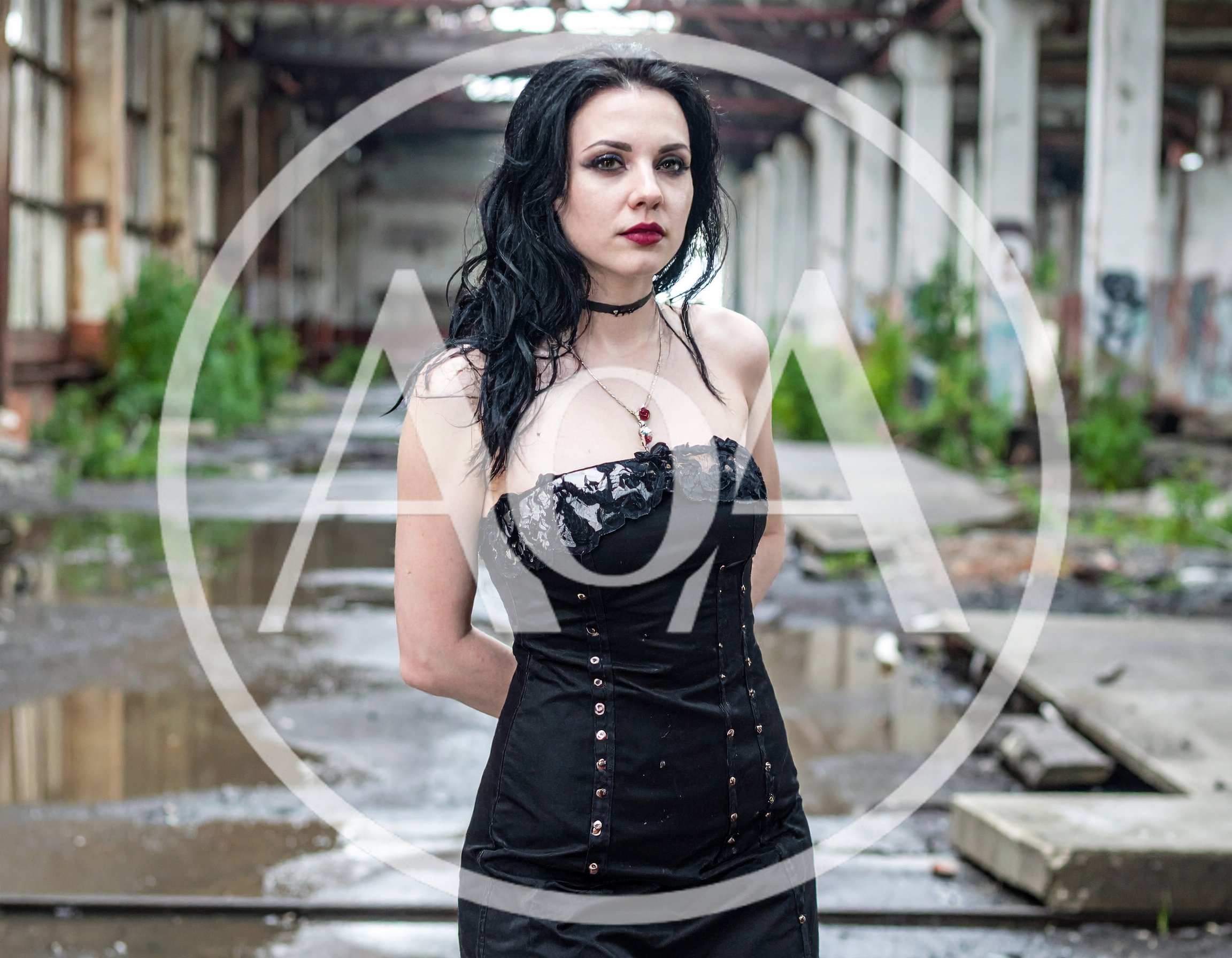 Gothic Woman Standing In An Abandoned Industrial Warehouse