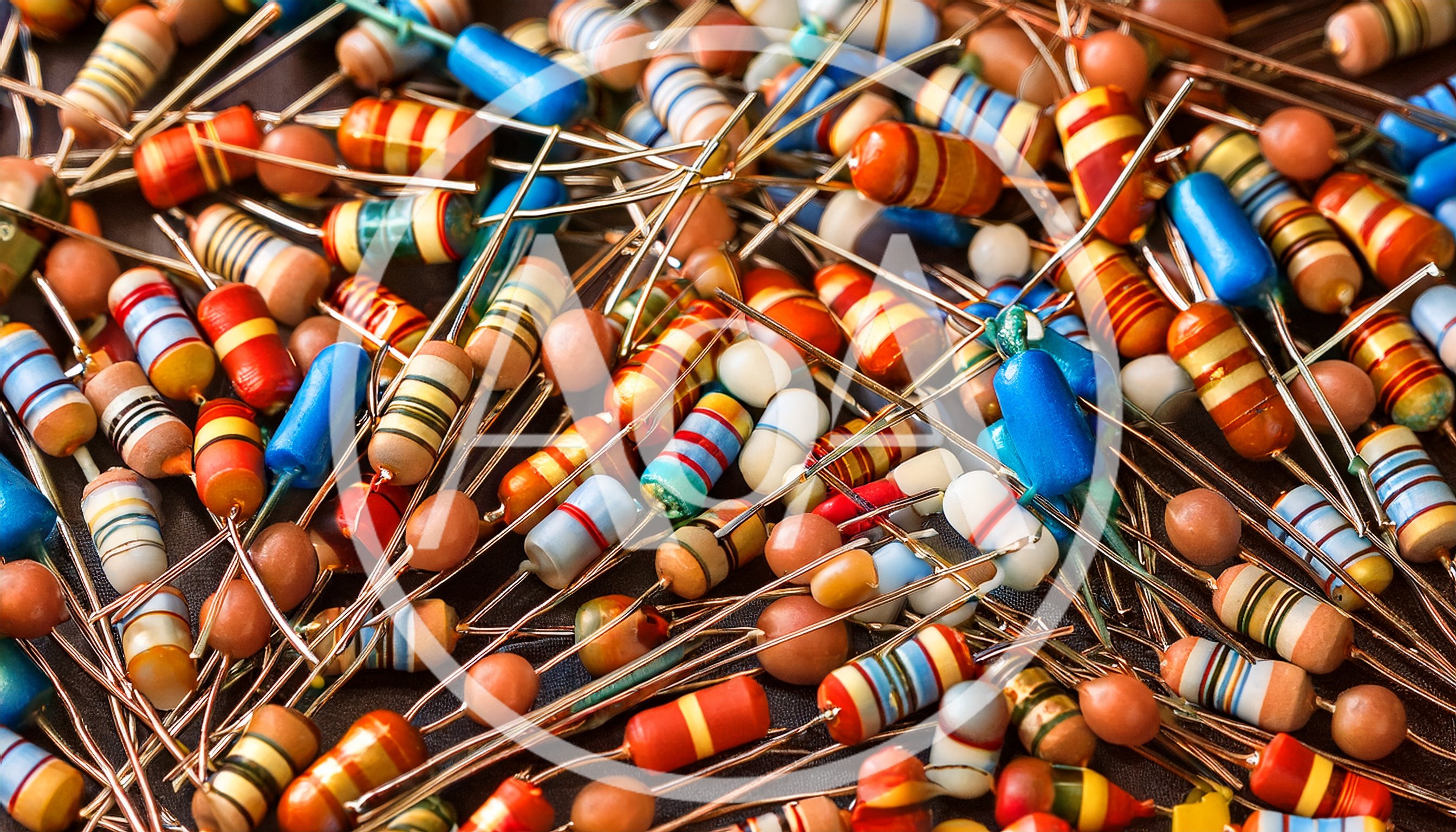 Assorted Electronic Resistors Scattered On A Dark Surface