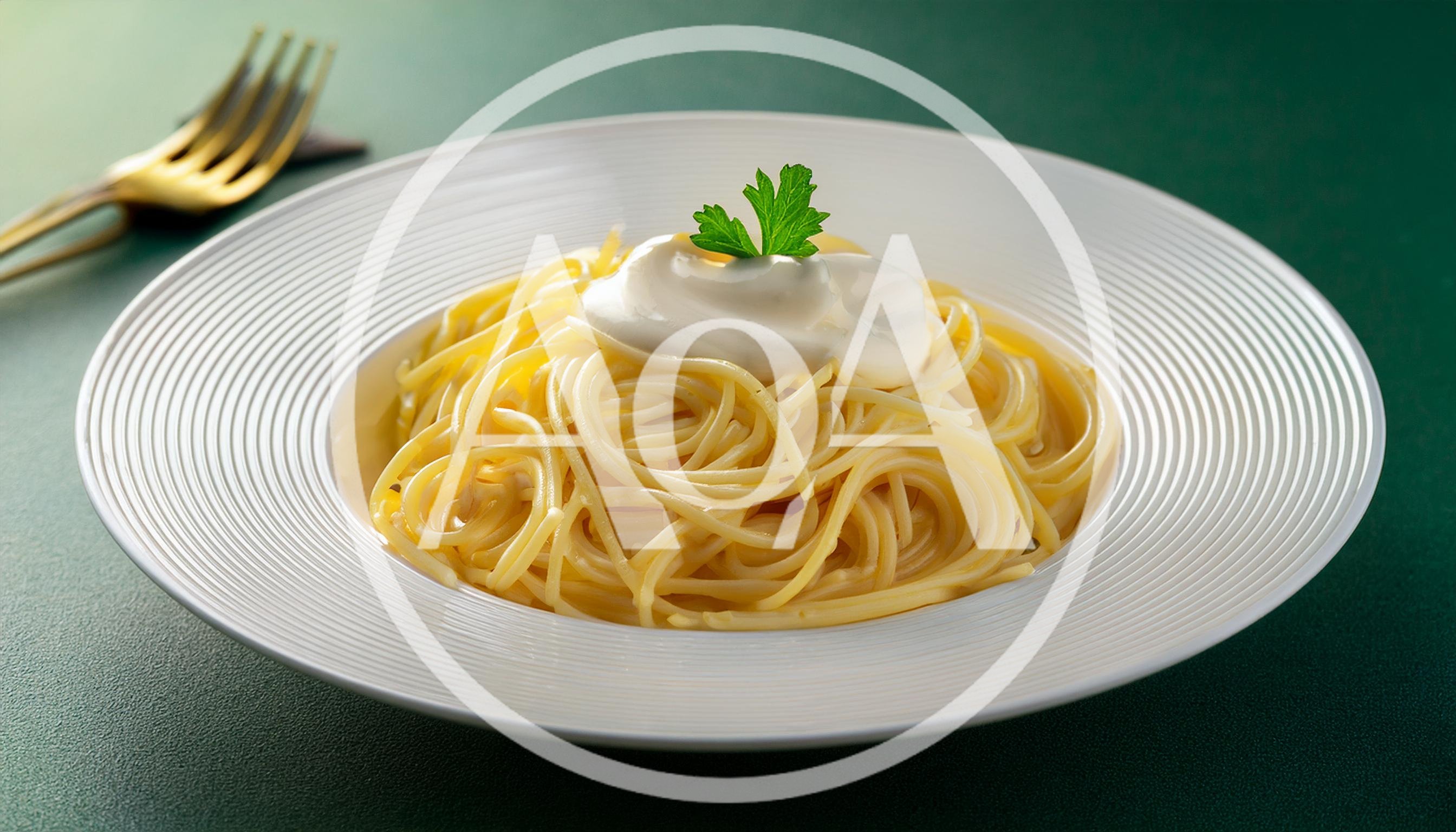 Spaghetti Pasta With Cream Sauce And Parsley Garnish