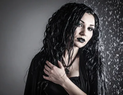 Gothic Woman With Wet Hair Standing In Rain
