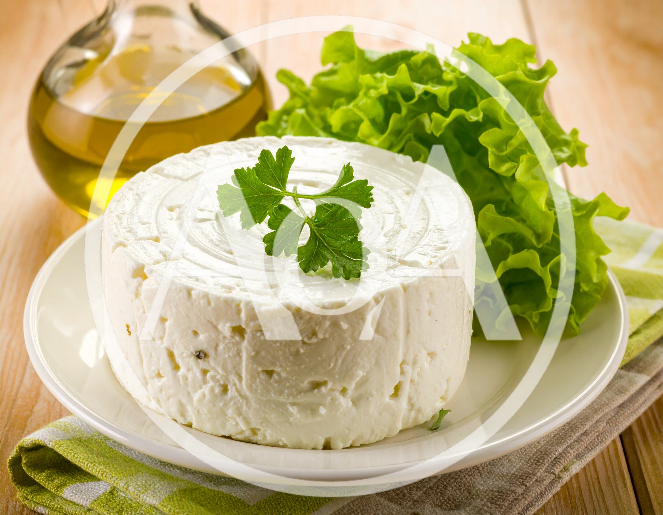 Fresh Round Cheese Wheel With Parsley And Lettuce