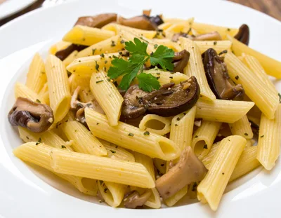 Penne Pasta With Sautéed Mushrooms And Fresh Parsley