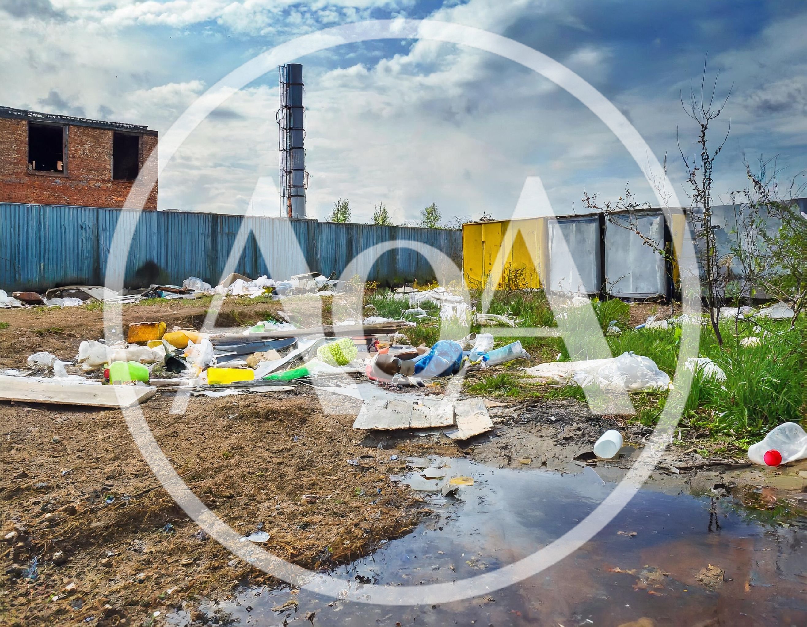 Polluted Industrial Wasteland With Scattered Trash And Debris