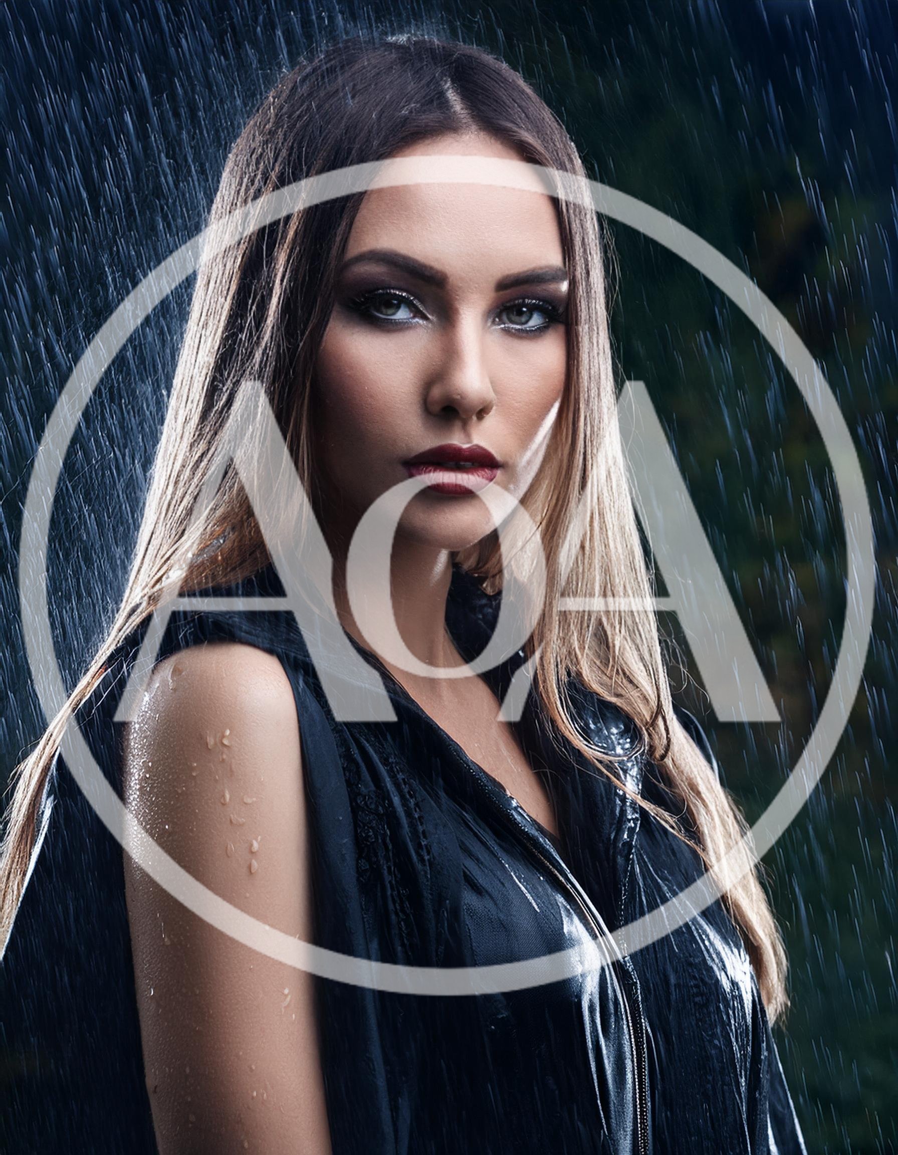 Portrait Of A Beautiful Woman In The Rain