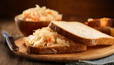 Sauerkraut Sandwich on a Wooden Cutting Board