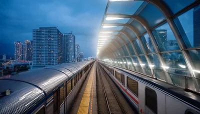 Modern Subway Train Arriving at Elevated Station Platform