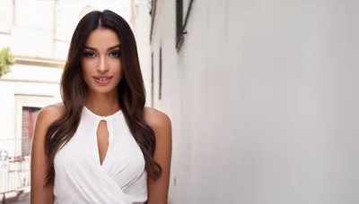 Portrait Of A Beautiful Young Woman In White Dress