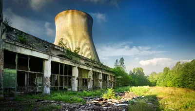 Abandoned Industrial Cooling Tower And Dilapidated Factory Building