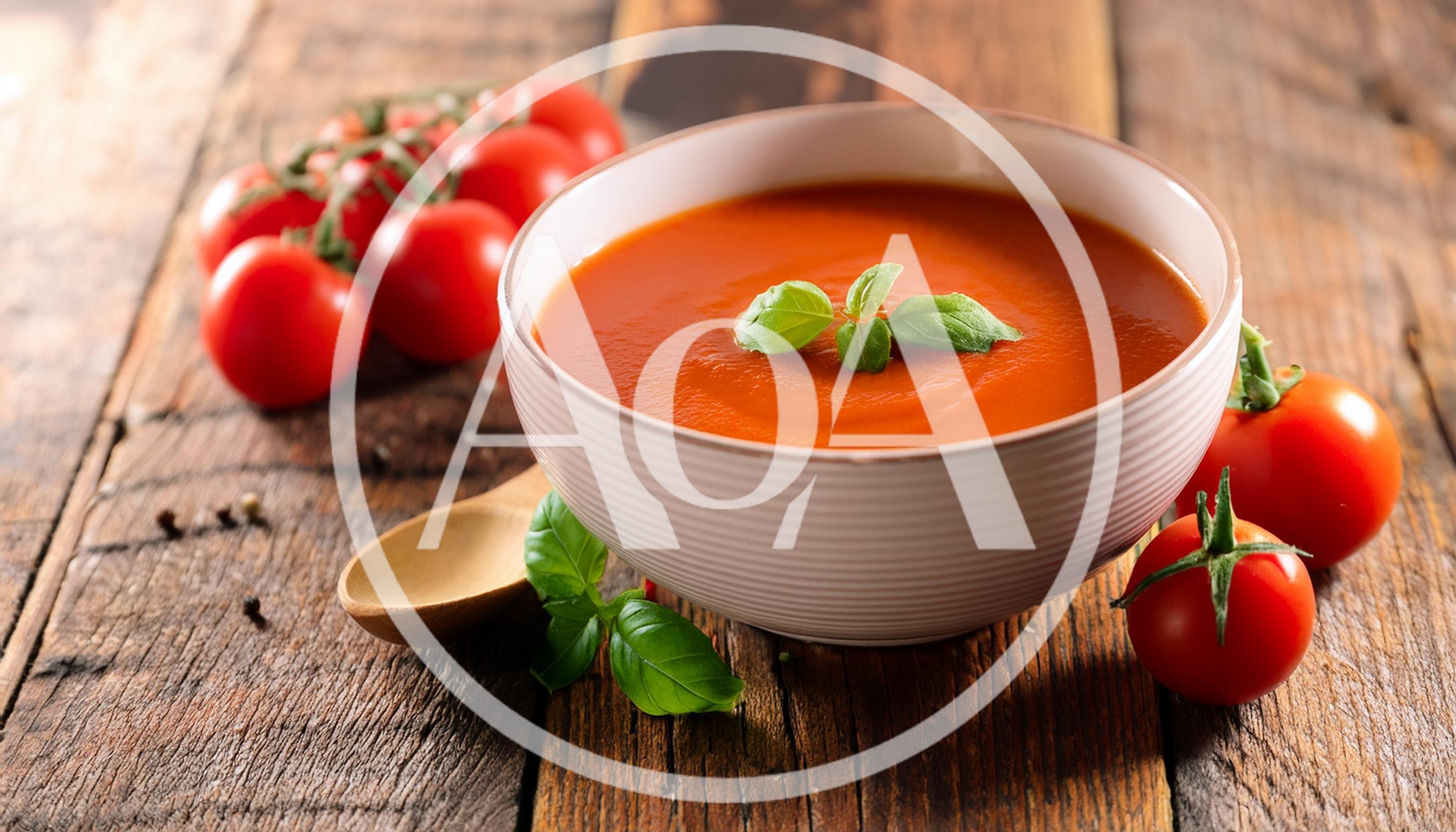 Bowl Of Tomato Soup With Fresh Basil And Tomatoes