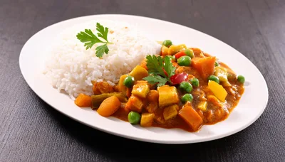 Vegetable Curry With Steamed White Rice On Plate