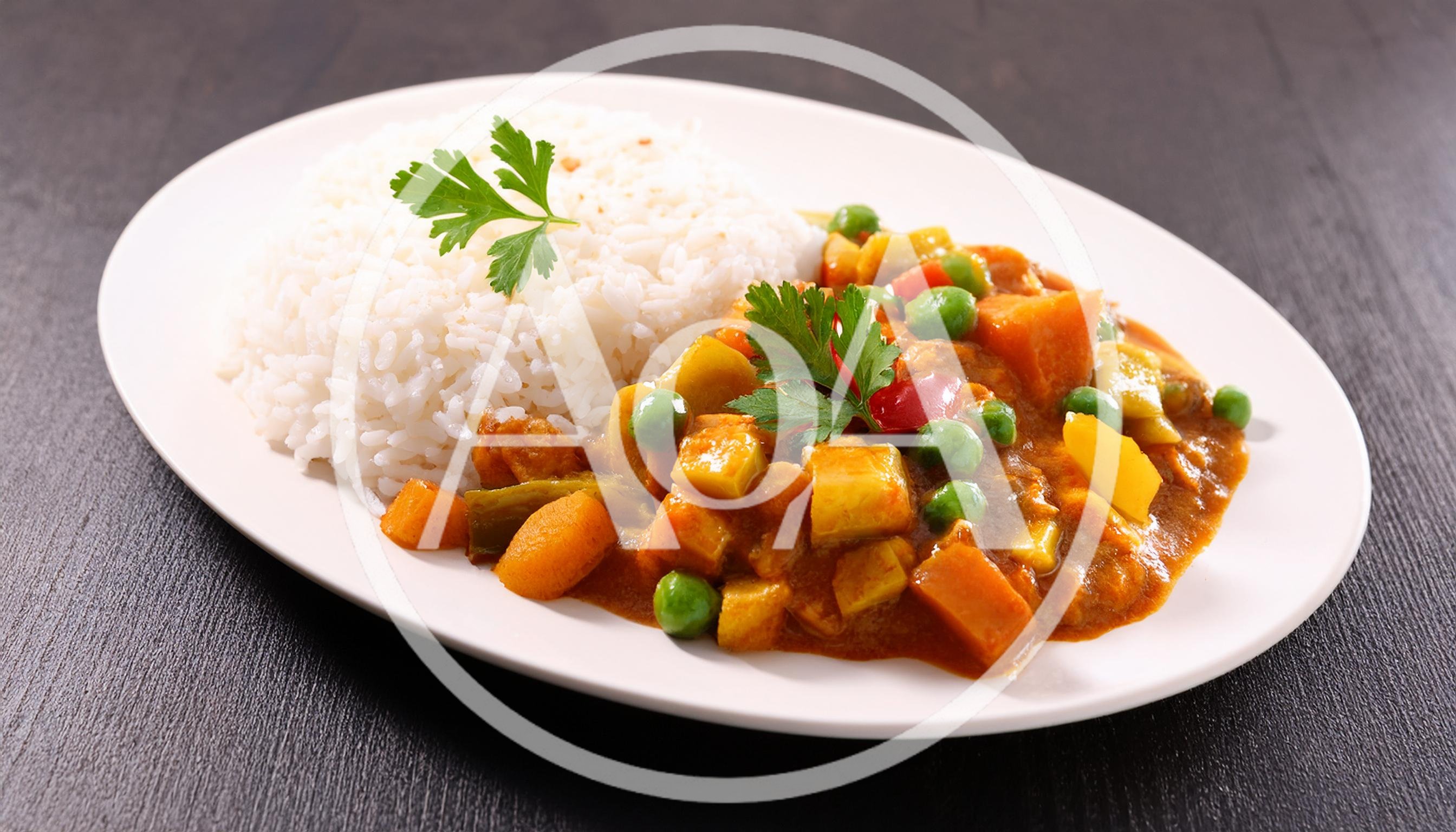 Vegetable Curry With Steamed White Rice On Plate