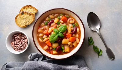 Bowl Of Hearty Vegetable Bean Soup With Bread