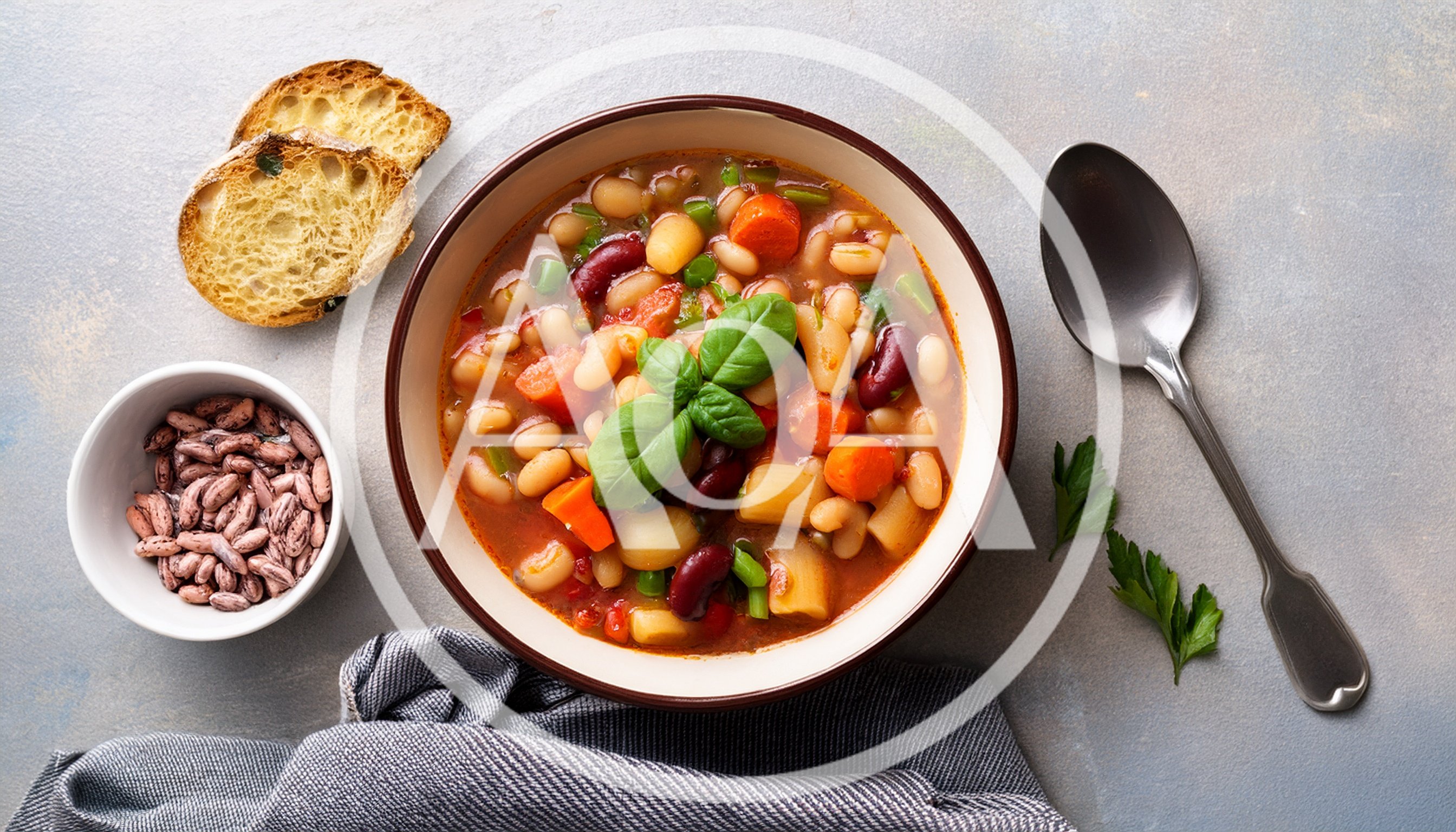 Bowl Of Hearty Vegetable Bean Soup With Bread