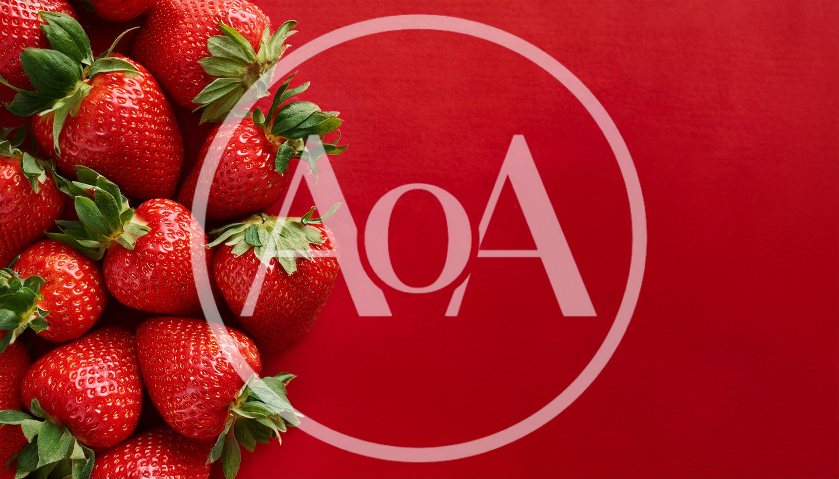 Fresh Ripe Strawberries Arranged On A Vibrant Red Background