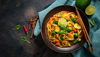 Bowl Of Thai Red Curry Noodles With Vegetables