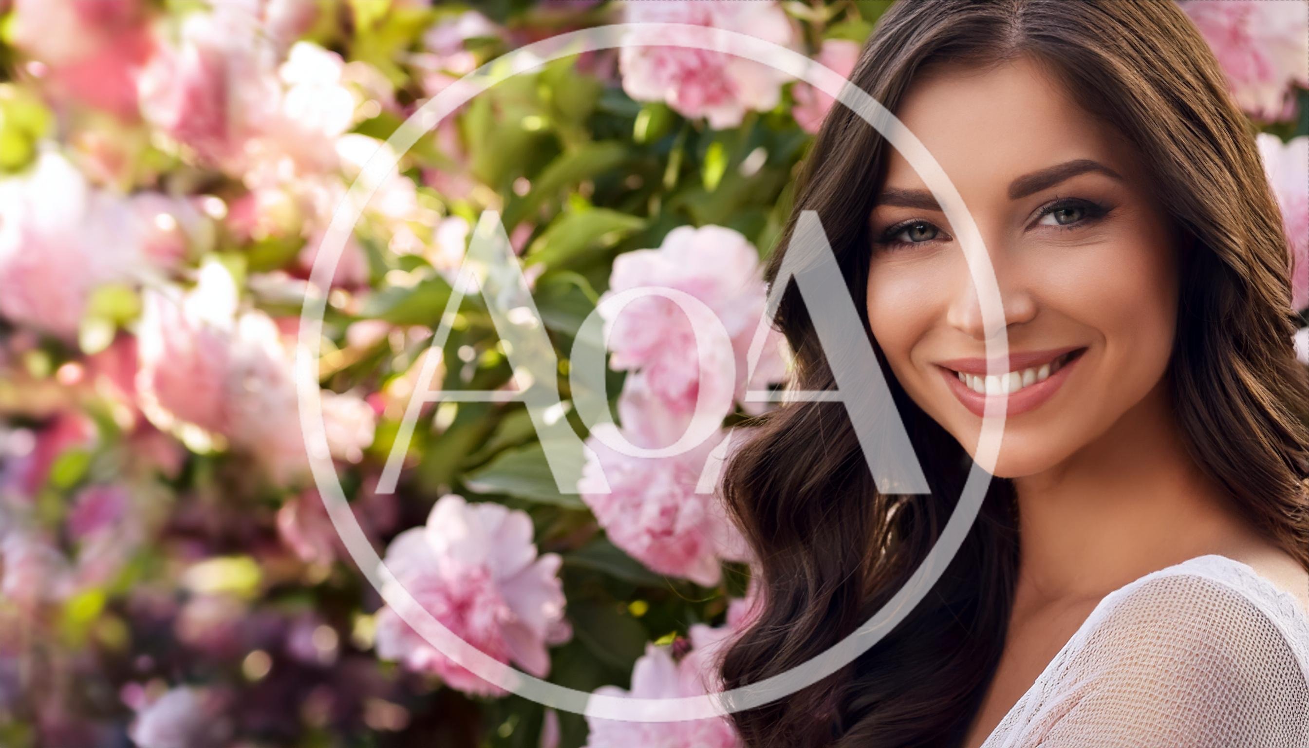 Beautiful Woman Smiling In Front Of Blooming Peonies