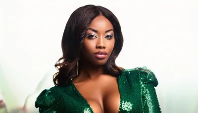 Portrait Of A Glamorous Woman In A Green Sequin Dress