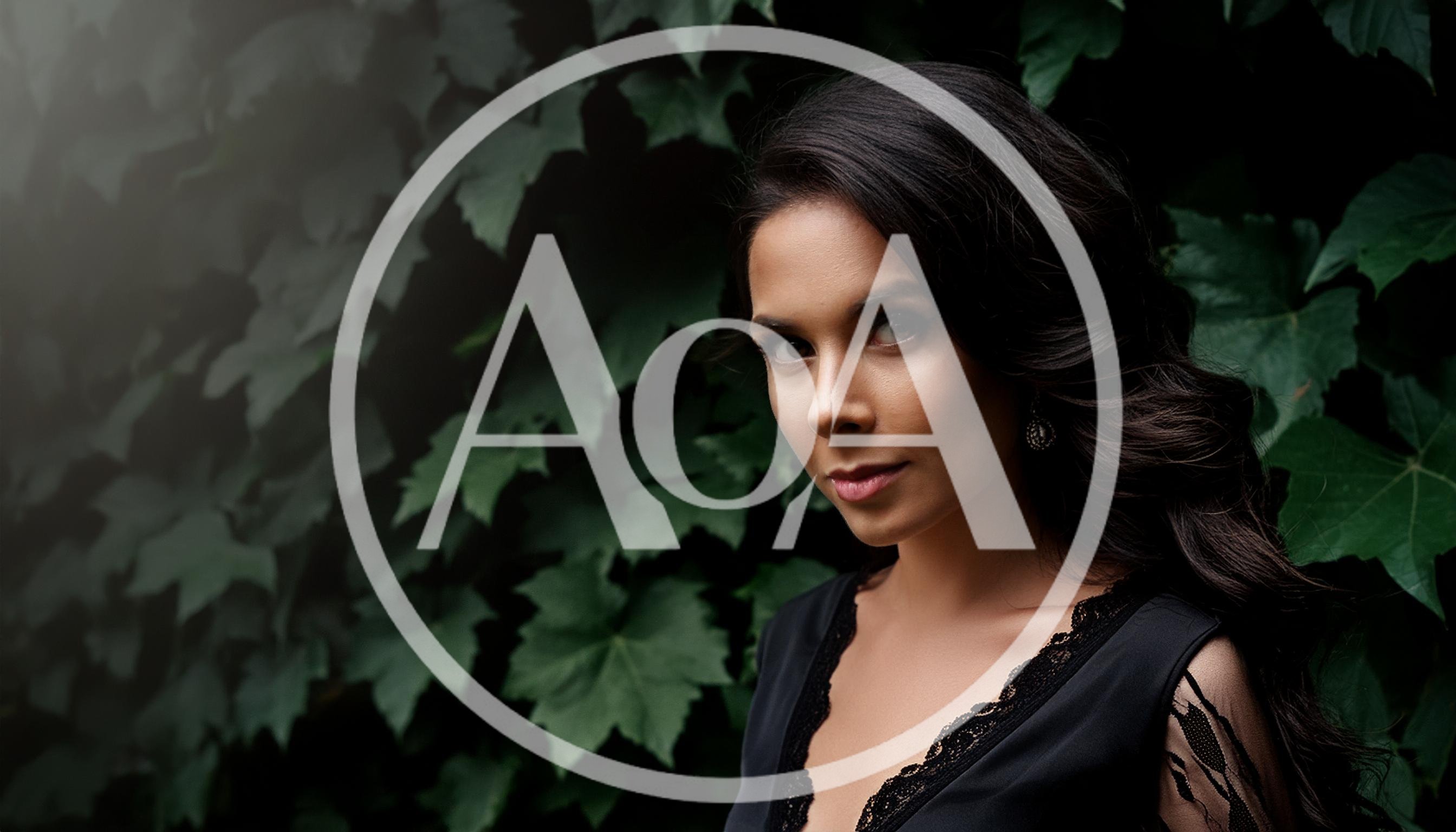 Portrait Of A Beautiful Woman Against Ivy Leaves