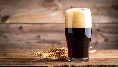 Glass of Dark Stout Beer with Wheat Stalks