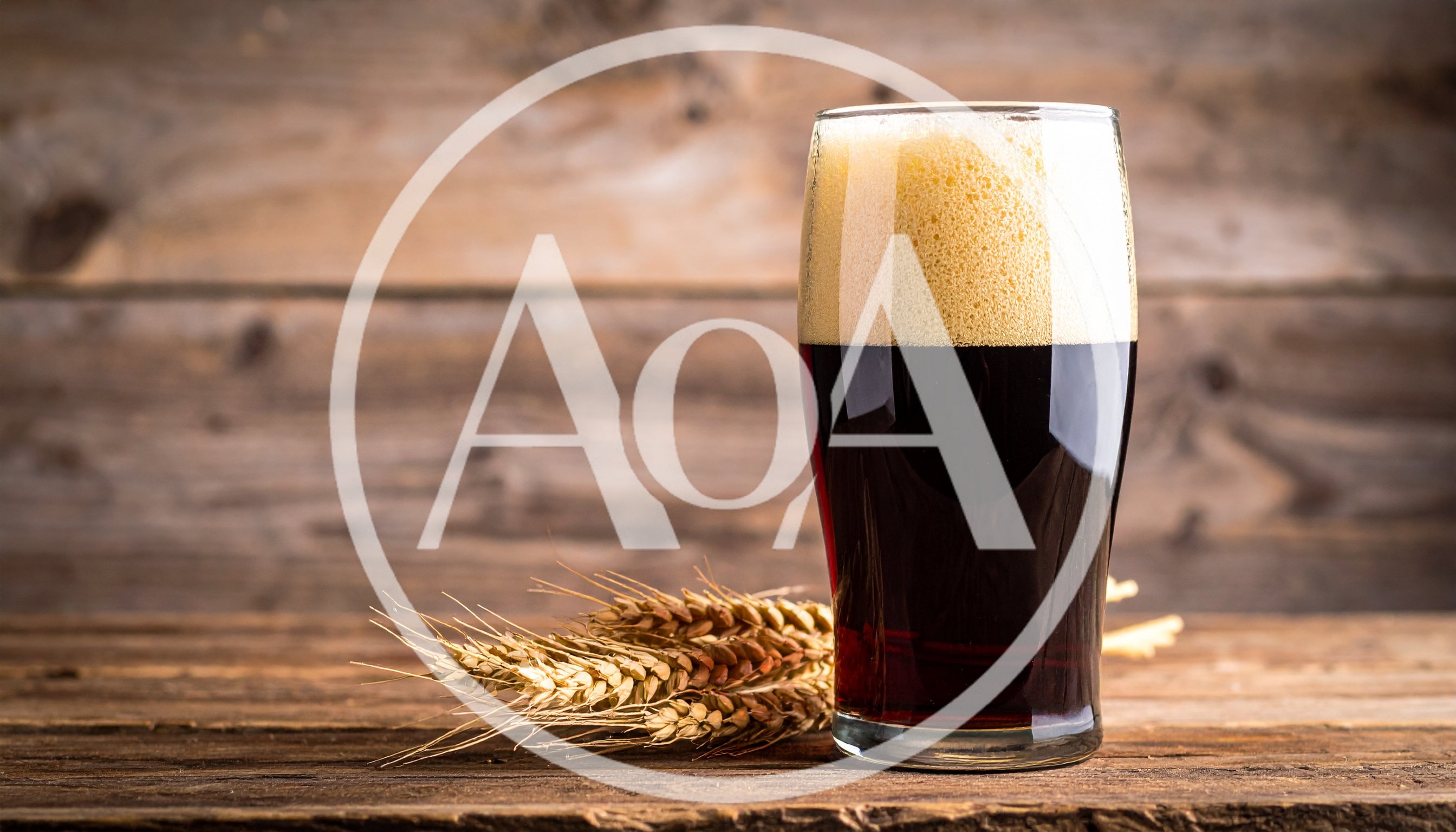 Glass of Dark Stout Beer with Wheat Stalks