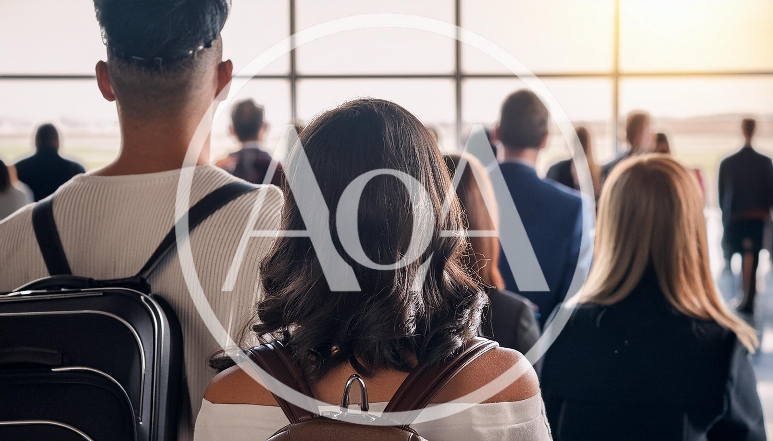Diverse Travelers Waiting In Airport Terminal Departure Lounge