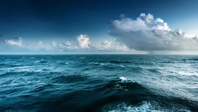 Choppy Dark Blue Ocean Waves Under Stormy Clouds
