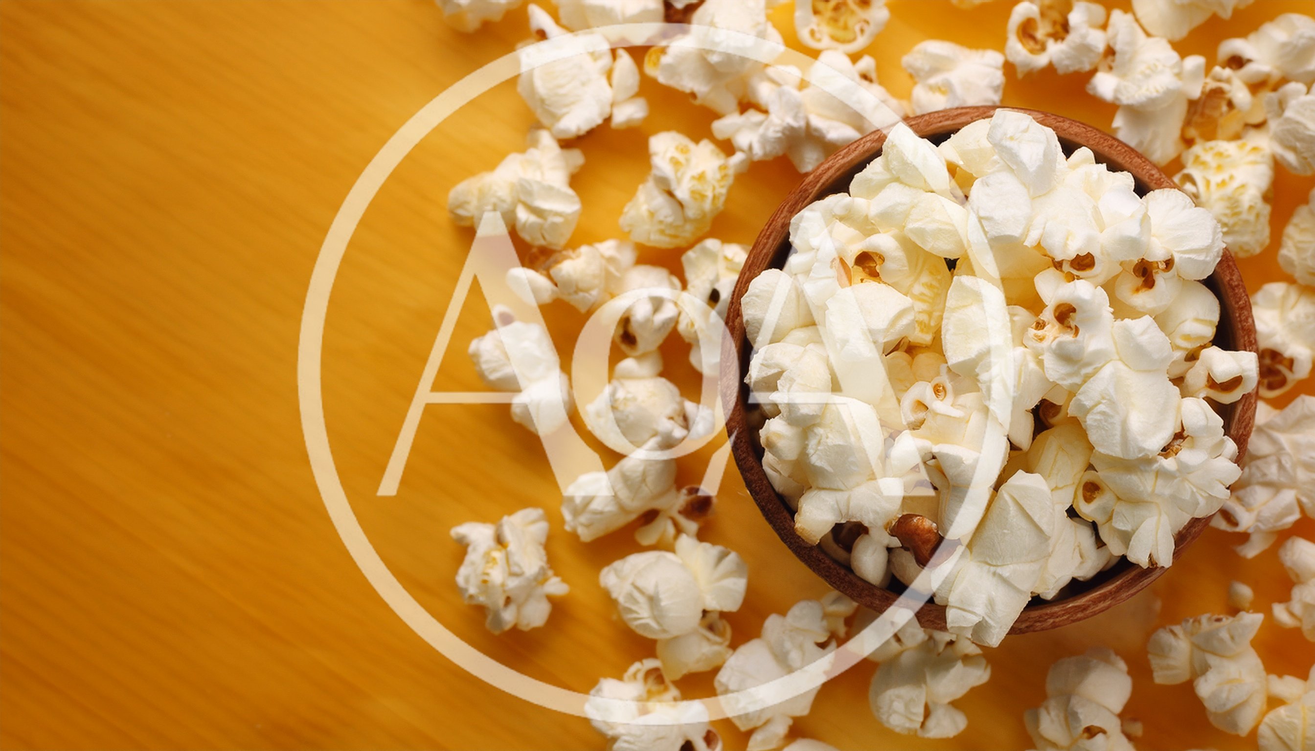 Wooden Bowl Filled With Freshly Popped Popcorn