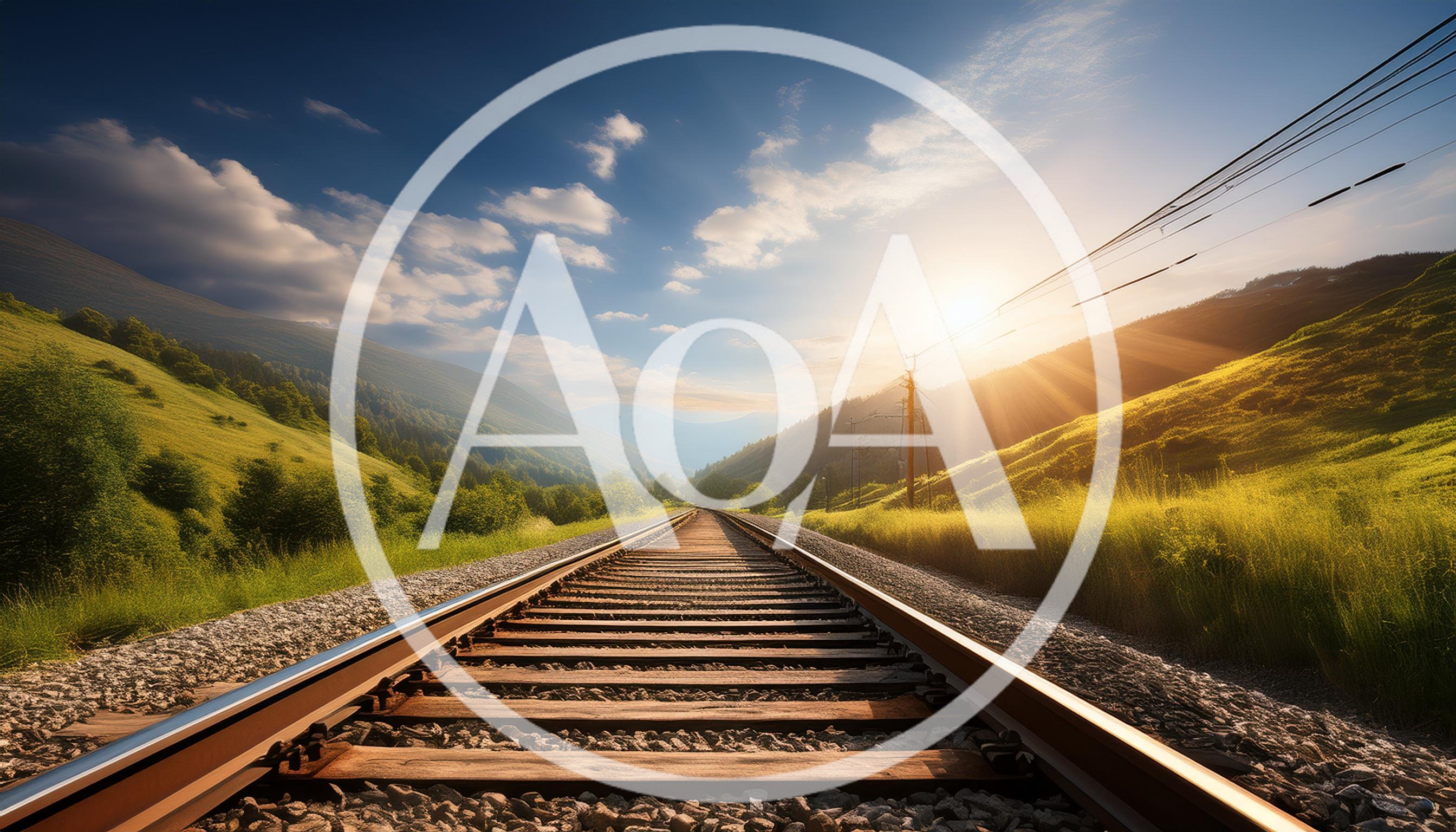 Railway Tracks Leading Through A Scenic Mountain Valley