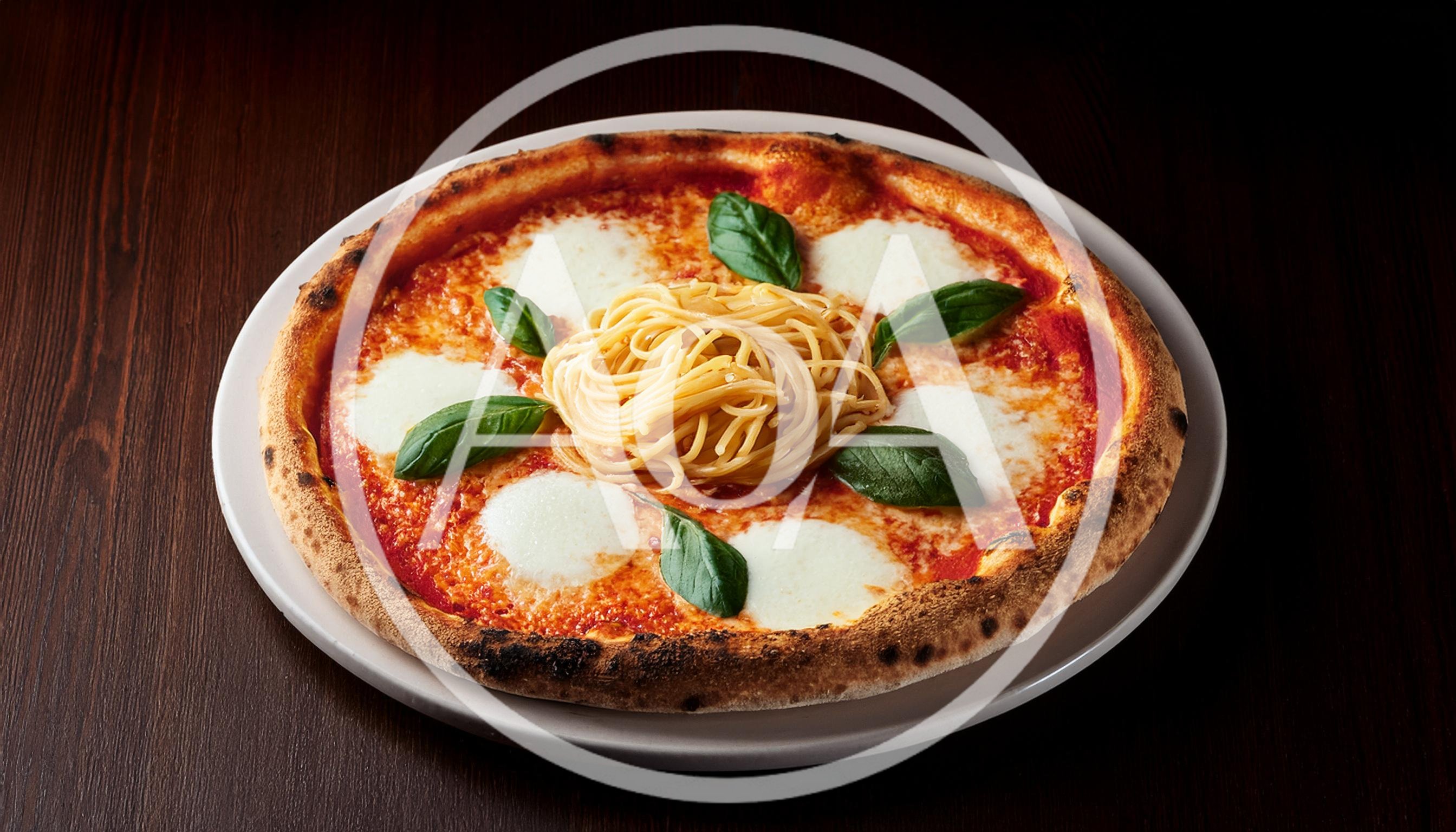 Margherita Pizza Topped With A Nest Of Spaghetti