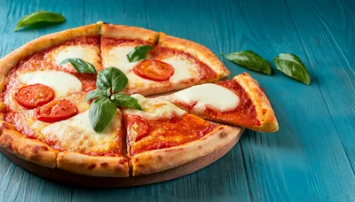Fresh Margherita Pizza With Basil On Blue Wood