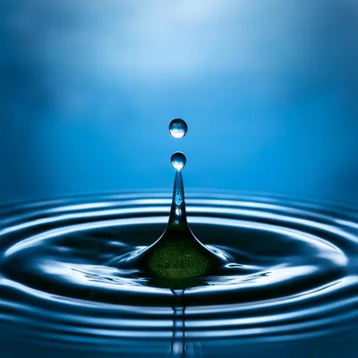 Water Drop Impact Creating Concentric Ripples
