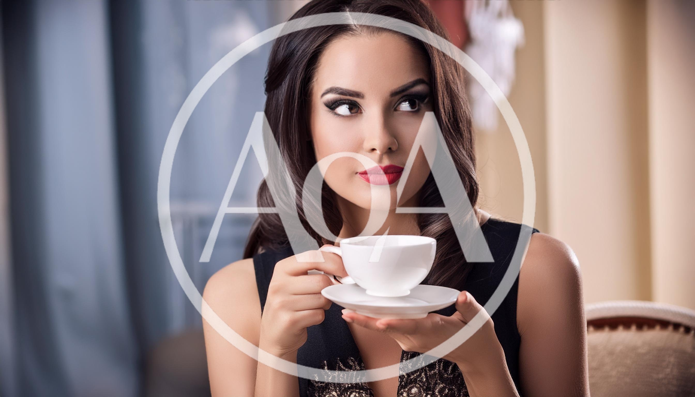 Elegant Woman Holding A White Tea Cup