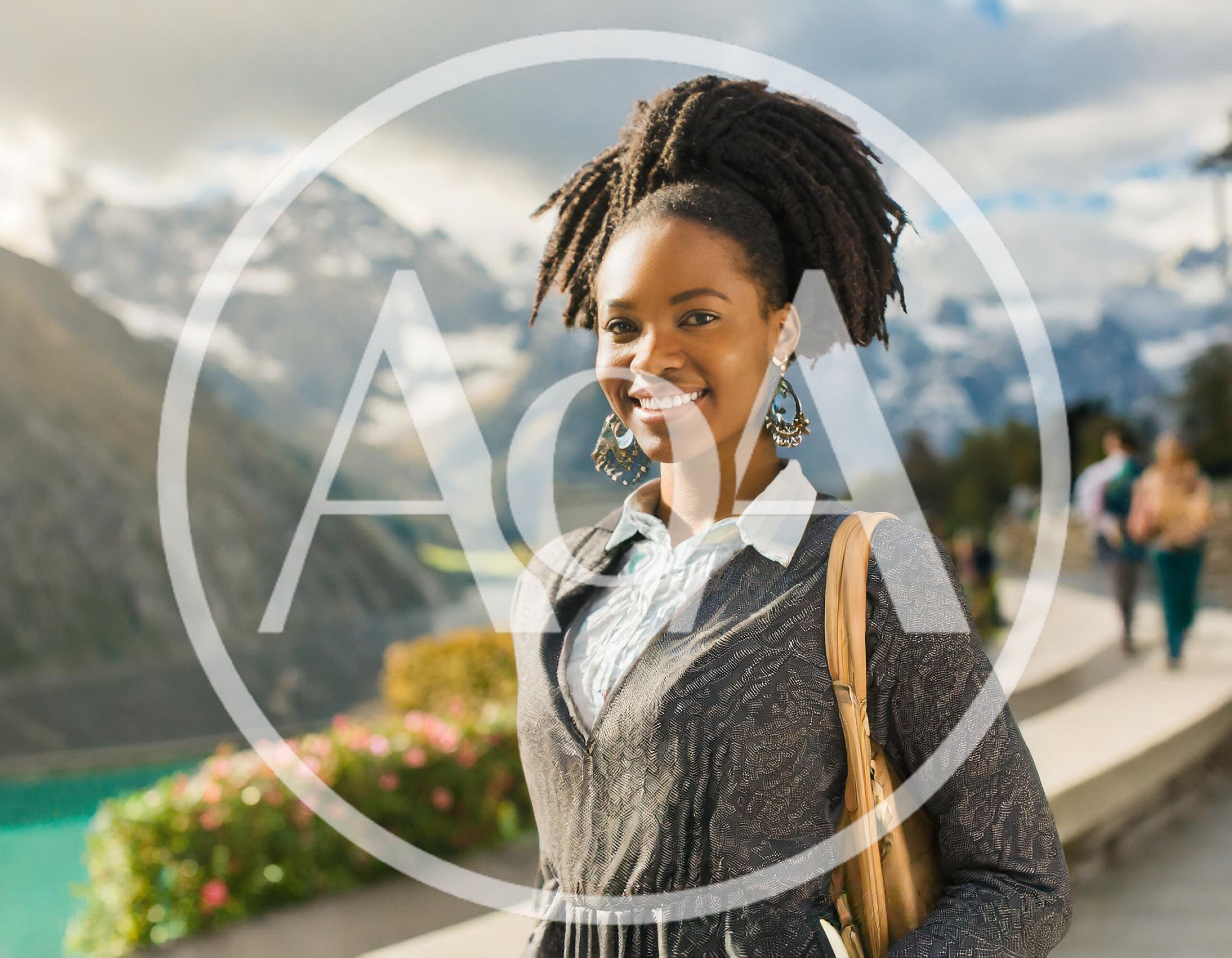 Smiling Young Woman With Dreadlocks In Mountain Landscape