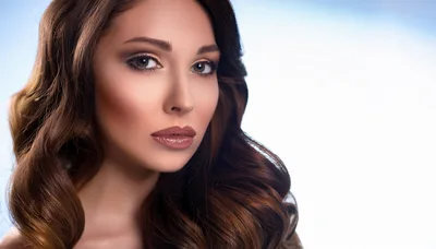 Portrait Of A Beautiful Woman With Wavy Brown Hair
