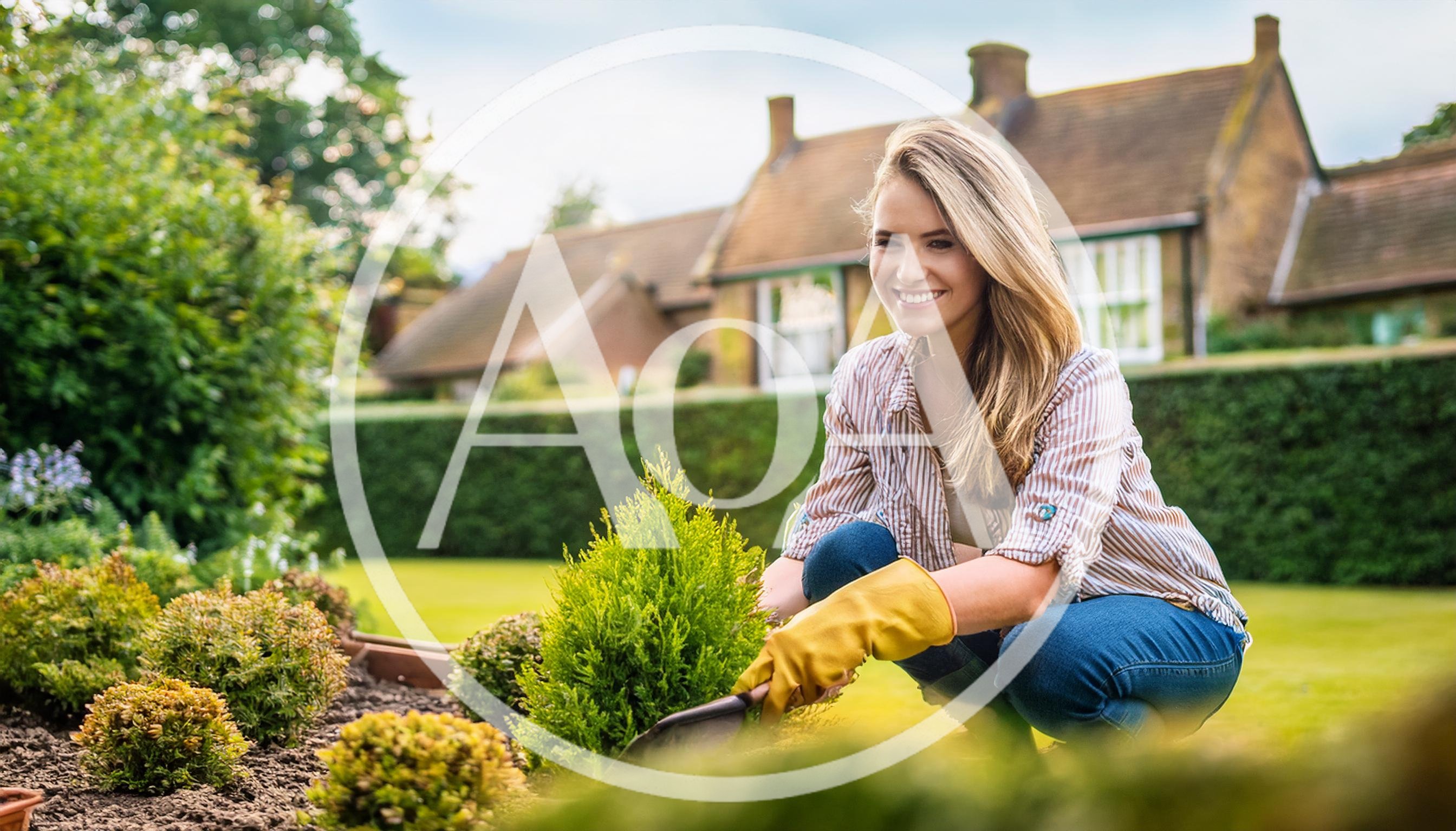 Young Woman Gardening In A Sunny Backyard