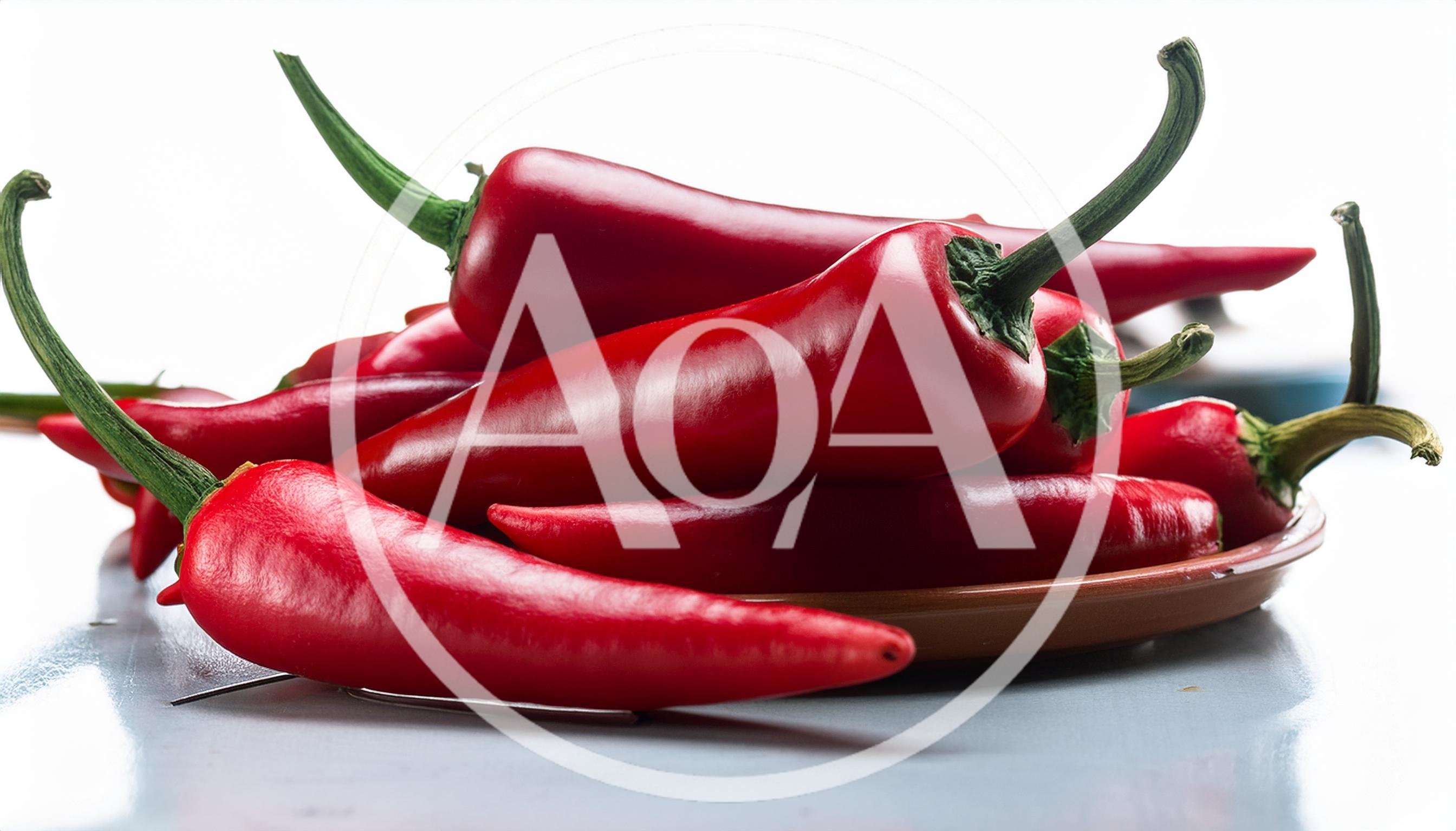 Fresh Red Chili Peppers On A Ceramic Plate