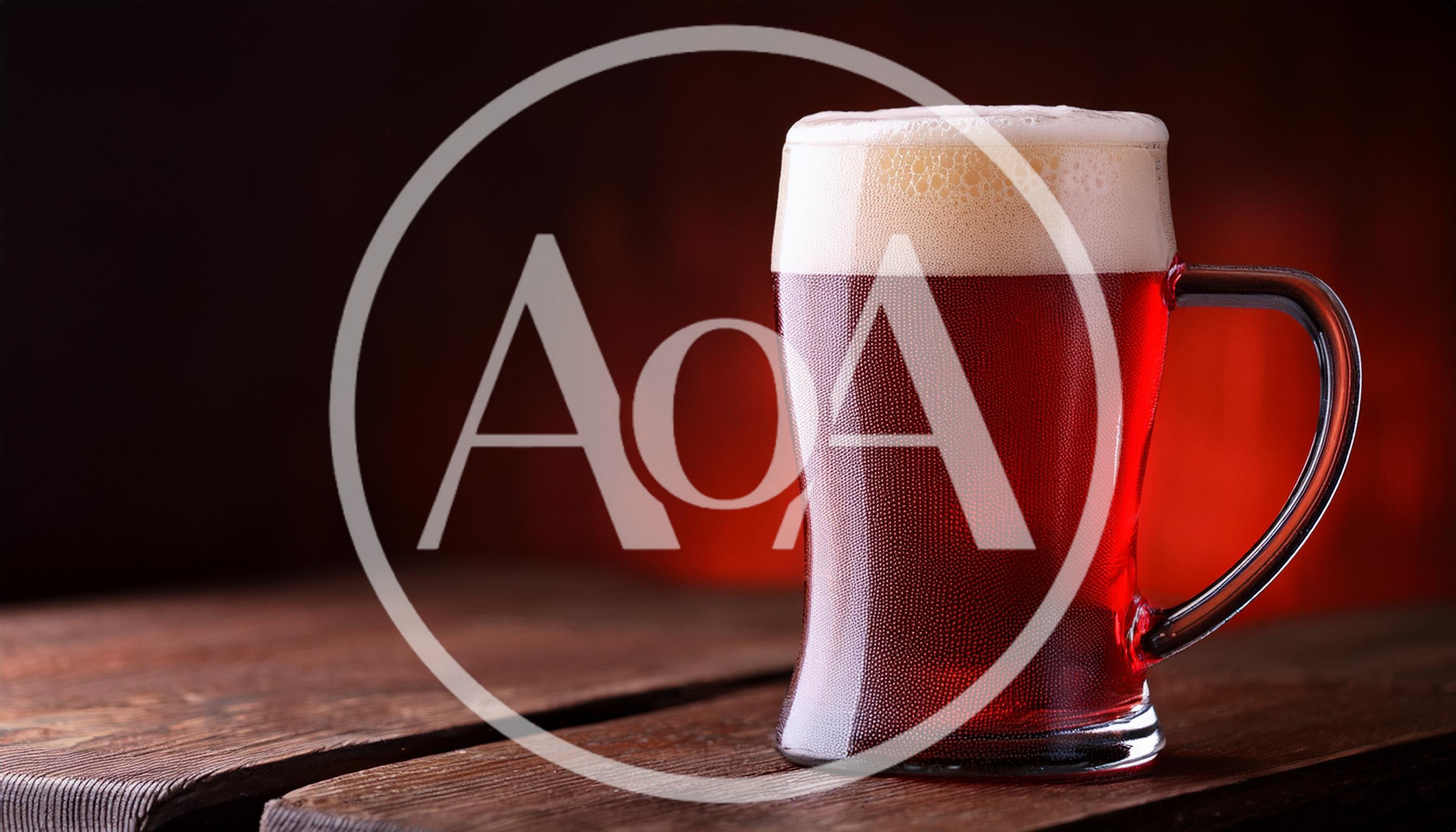 Glass Mug Of Dark Red Beer On Wooden Table