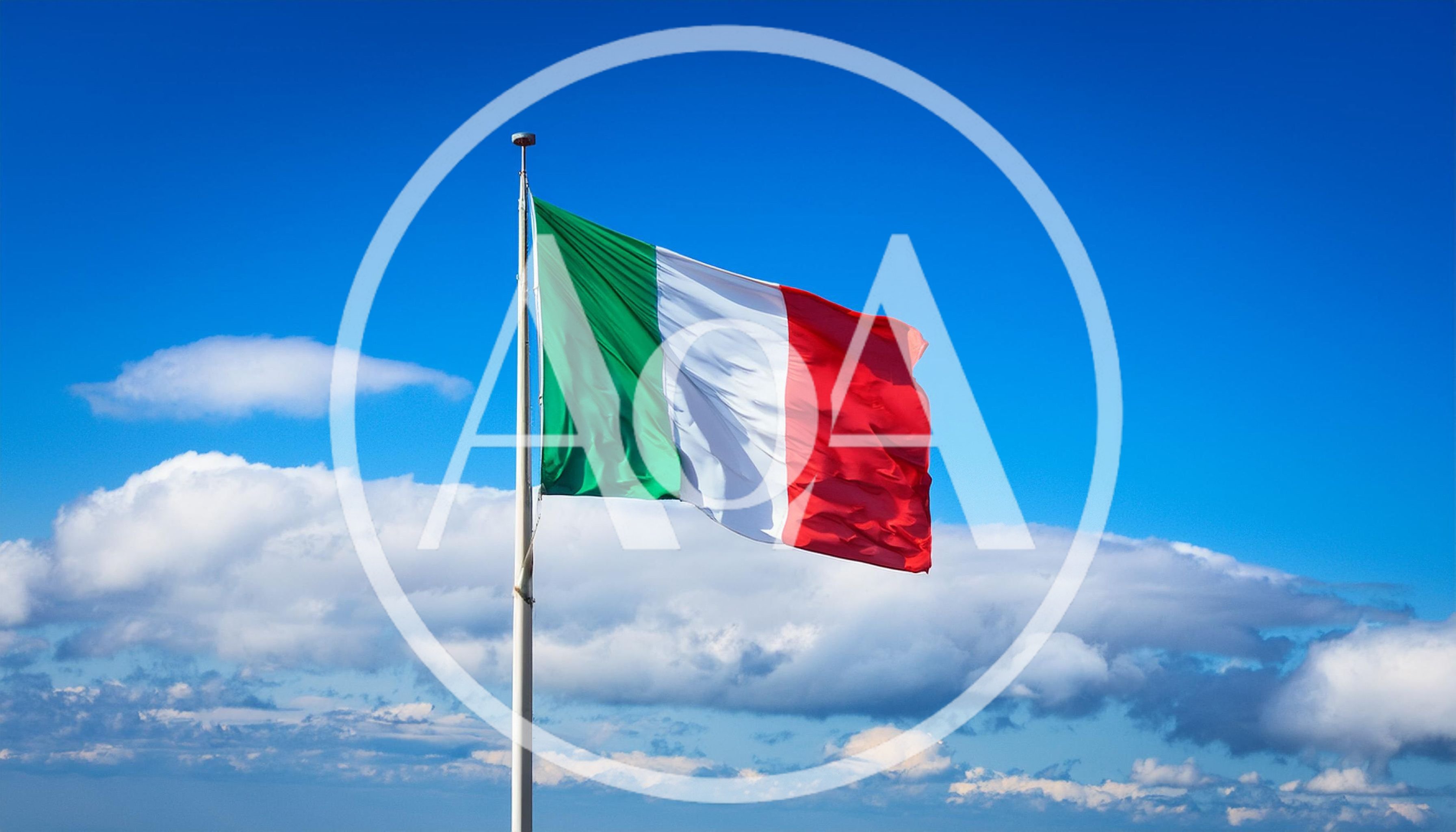 Italian Flag Waving Against A Clear Blue Sky