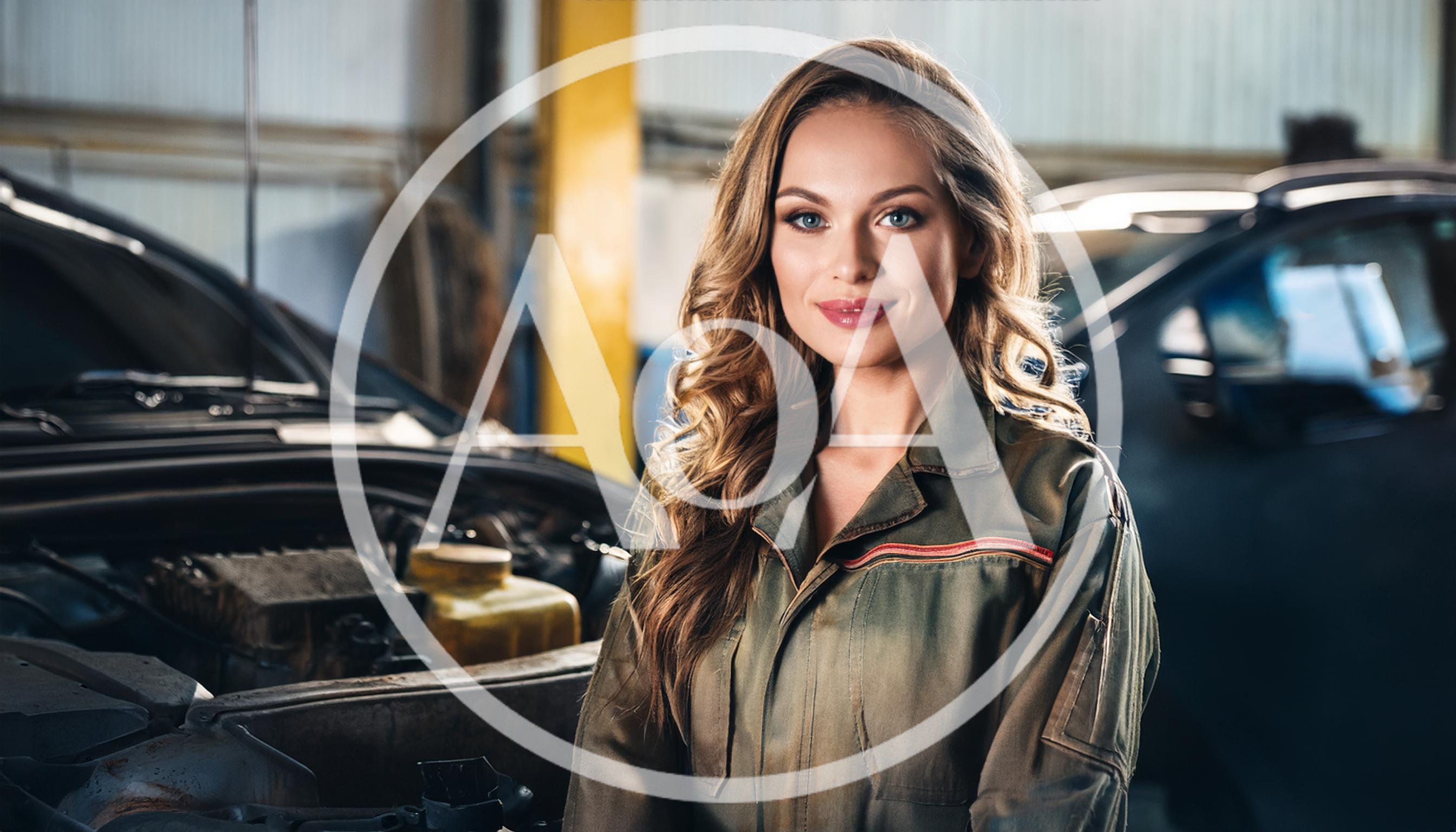 Female Mechanic Standing In A Professional Auto Repair Shop