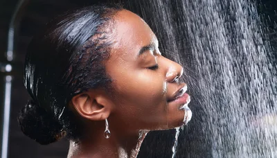 Young Black Woman Taking A Refreshing Shower