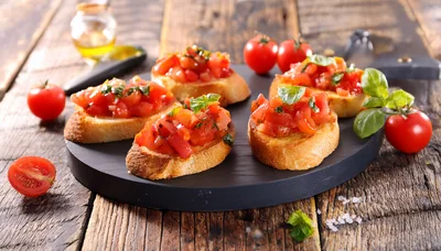 Fresh Tomato Bruschetta Appetizers On A Wooden Board