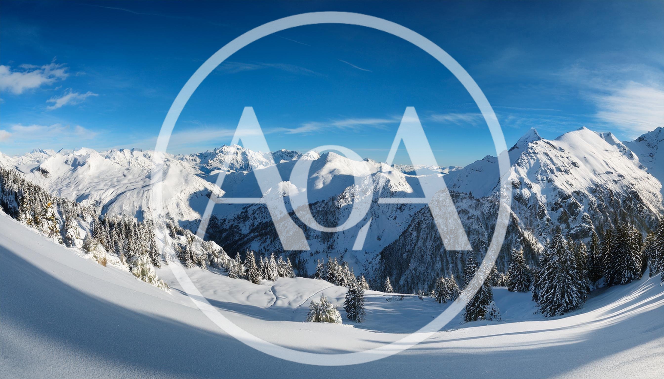 Panoramic View Of Snowy Alpine Mountain Peaks