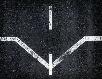 White Painted Road Markings On Dark Asphalt